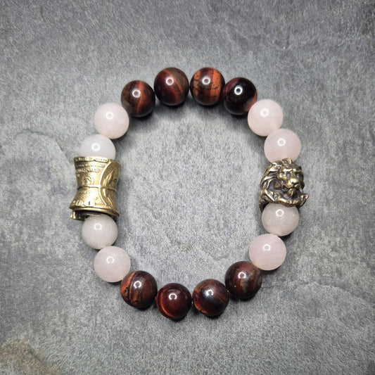 Perlenarmband mit Tigerauge, weiße
Jade und Loewenkopf, kombiniert mit einer goldenen Geldrolle, made in Germany